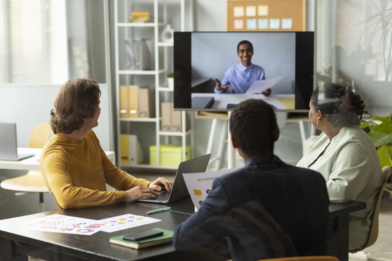 Students collaborating in an online class via video conference.